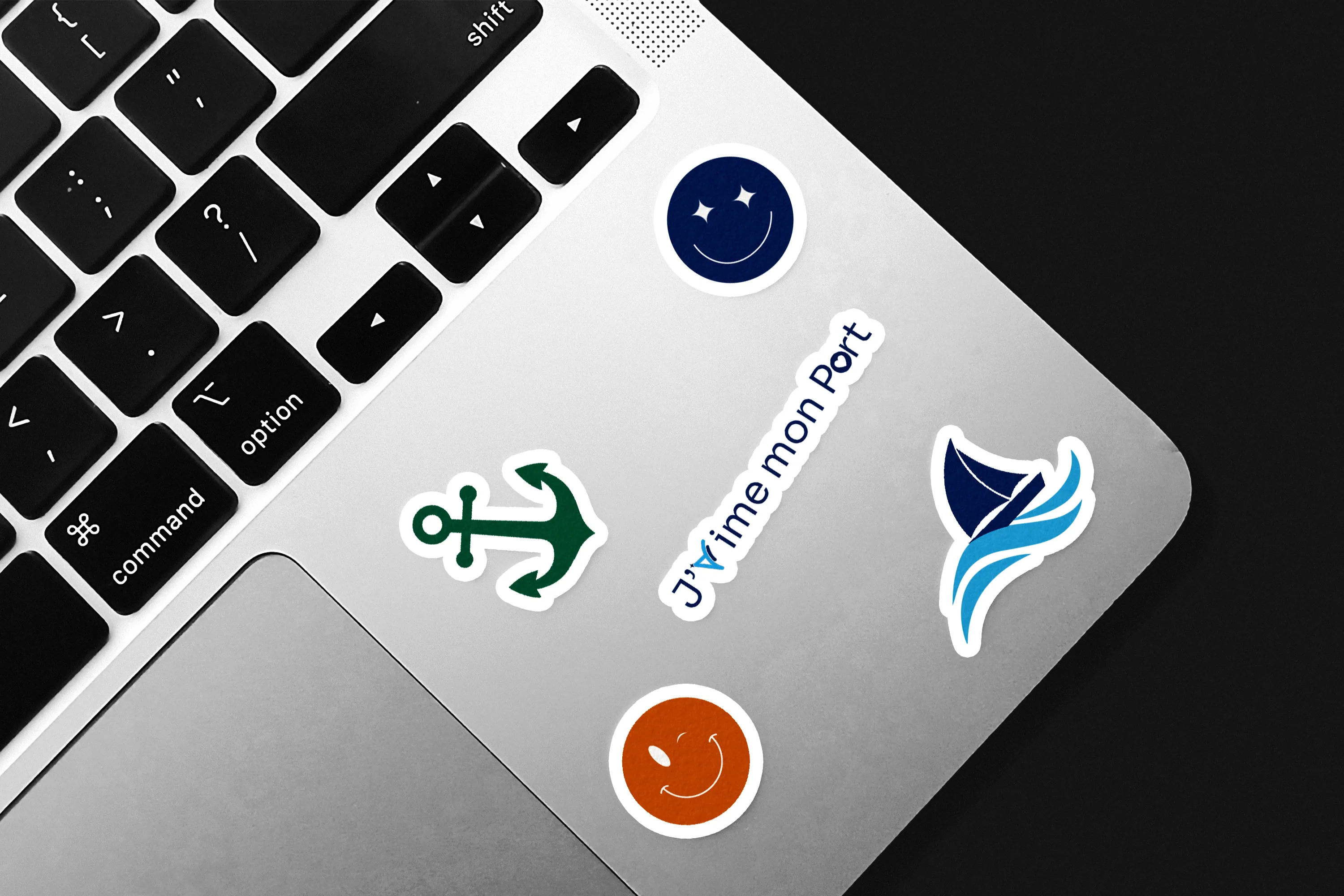 Sticker Mockup On Macbook.png
